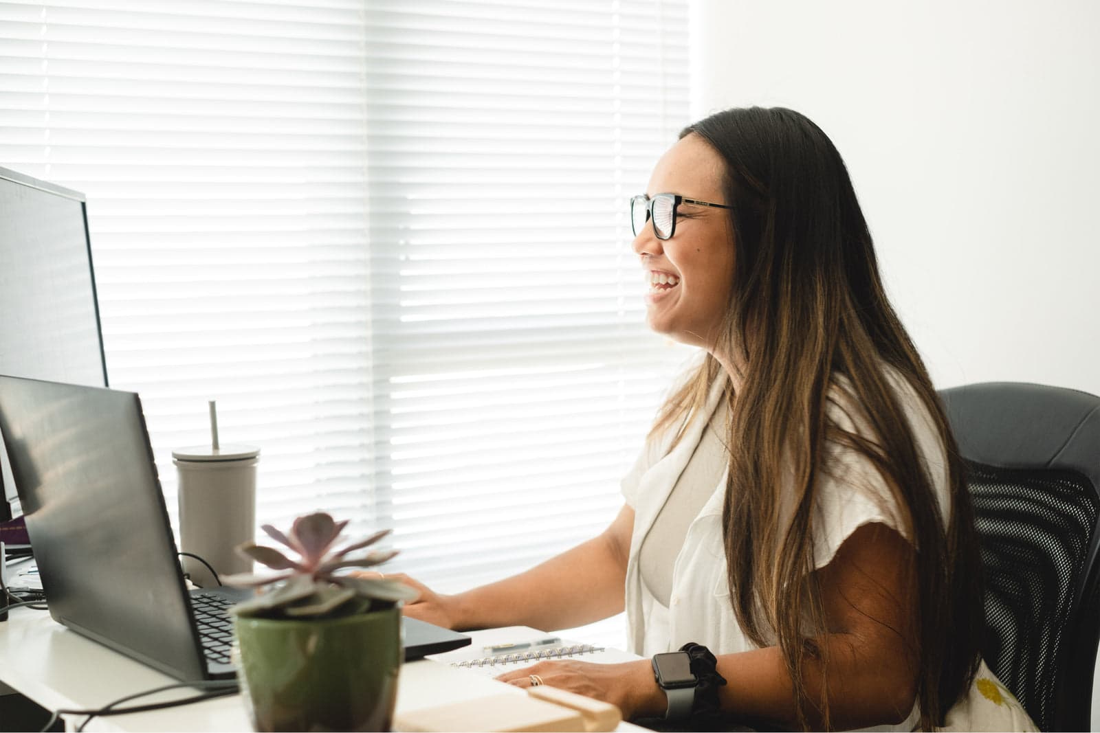 marketer working at a desktop monitor setup