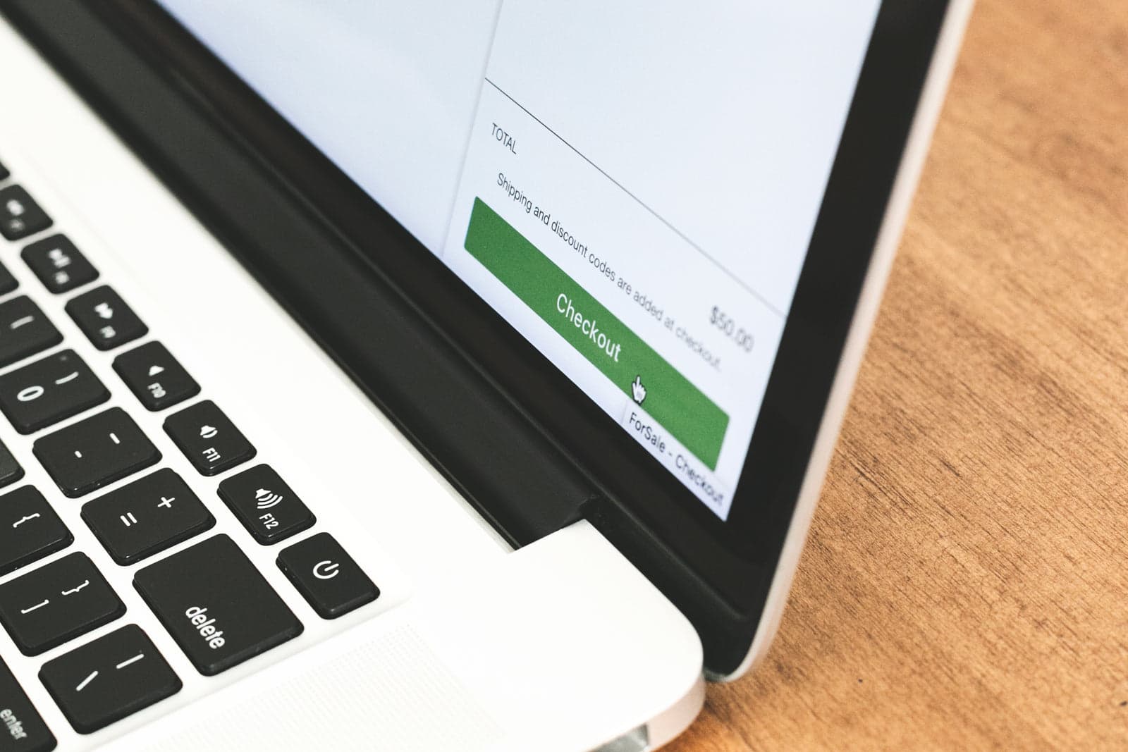 laptop screen showing an online checkout button