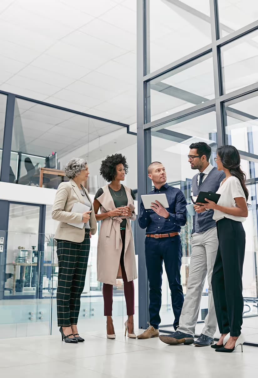 Team of professionals in discussion in a bright modern office