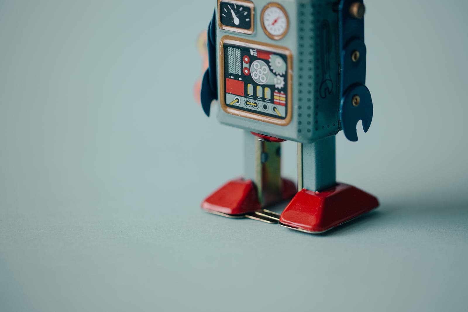 toy robot standing on a plain background