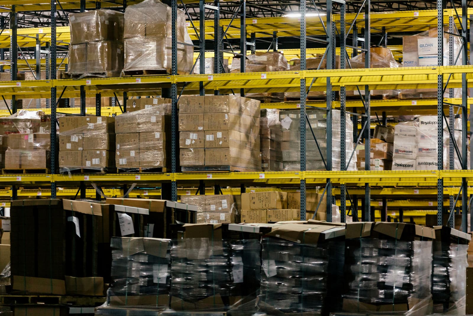 warehouse shelves stacked with cartons