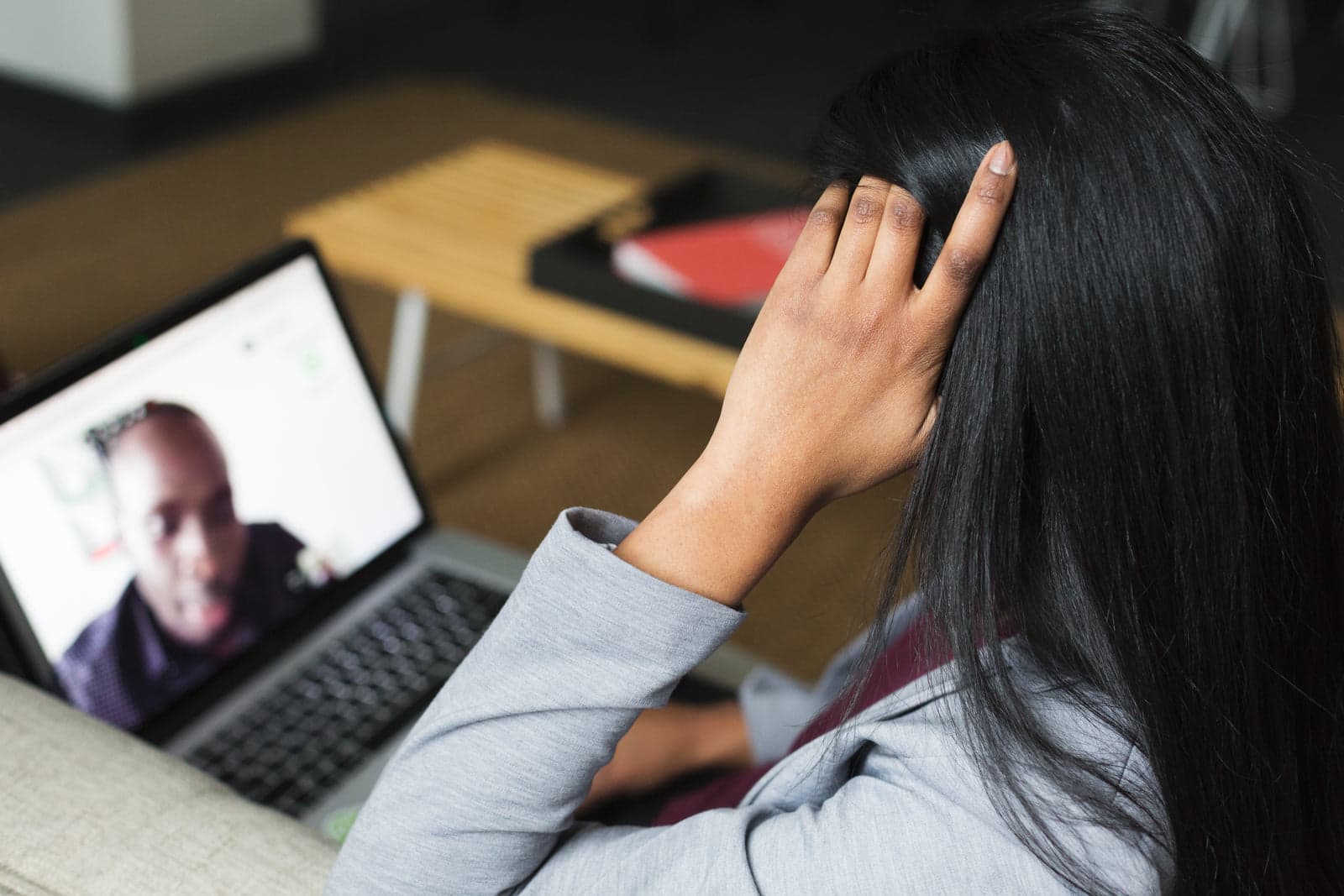 person attending an online video meeting