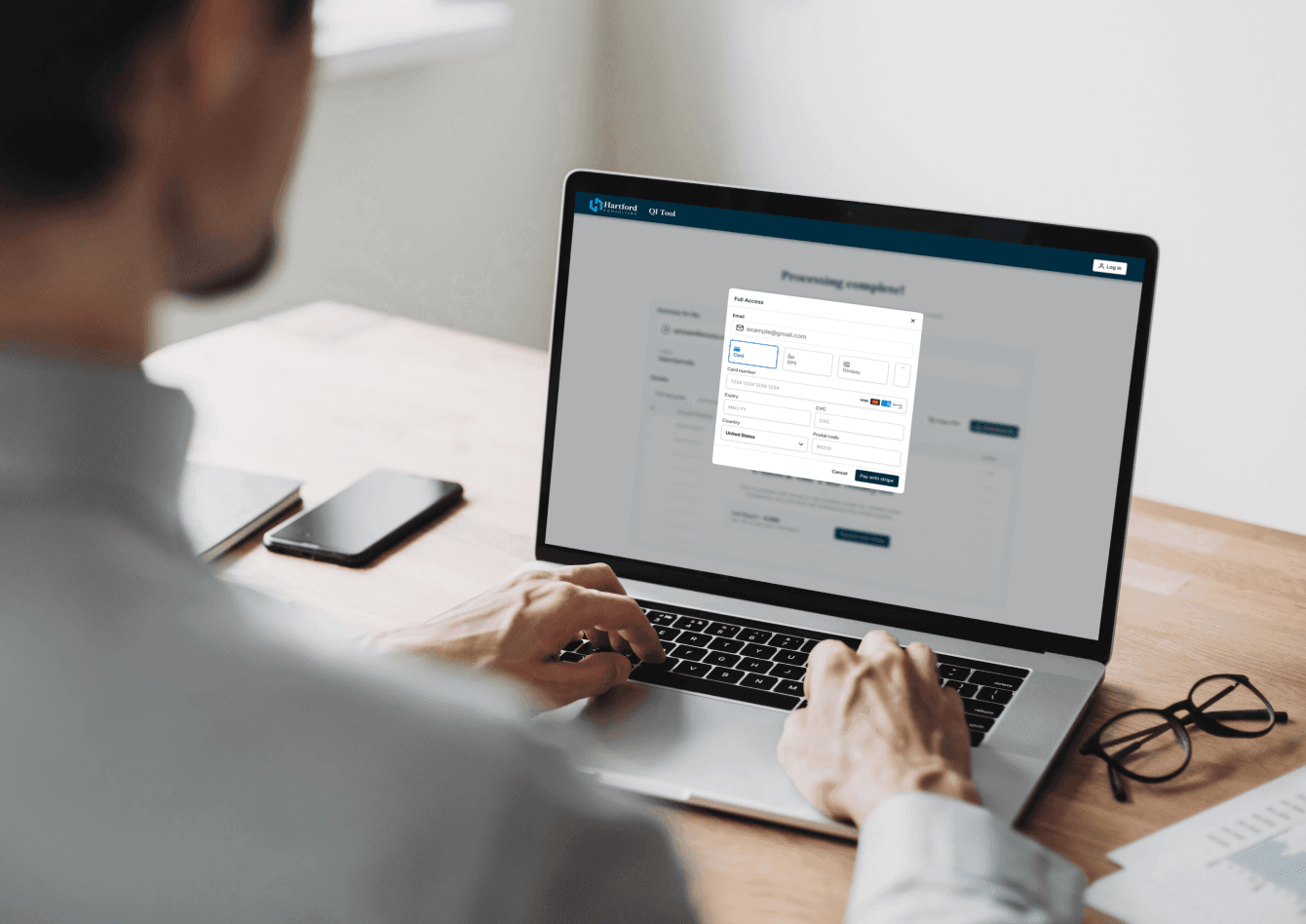 Person using the sample calculator web app on a laptop